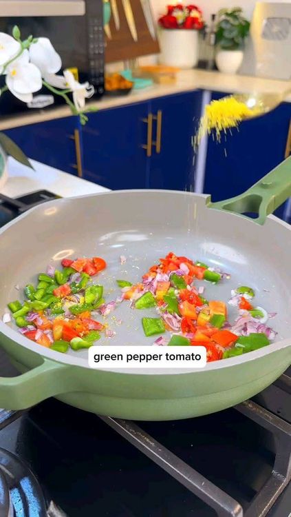 Step 2.4: In a pan with a little oil, stir-fry chopped onions, green pepper, and tomatoes