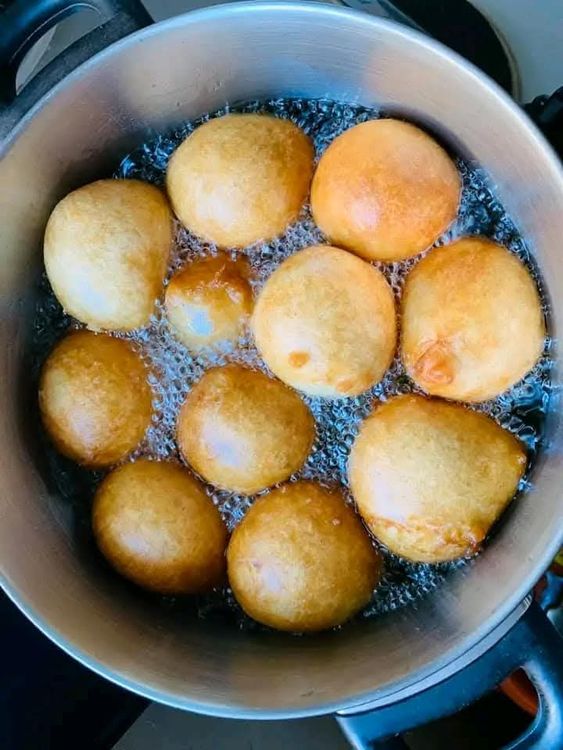 Step 1.4: Scoop with a deep small spoon or scoop the mold of your hand and Fry the dough until golden brown