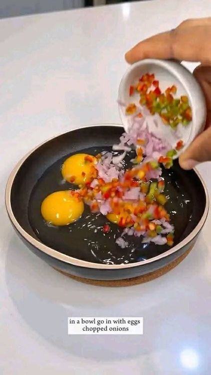 Step 1.2: Add chopped onions, chopped red and green peppers, seasoning, and salt to the eggs