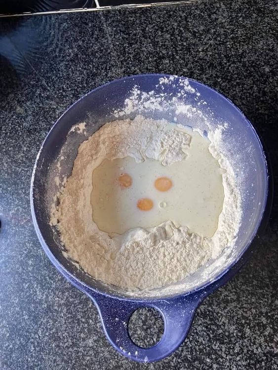 Step 1.1: Combine the dry ingredients and add warm milk or water and eggs