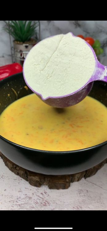 Step 1.2: Add flour and baking powder to the wet mixture and gently fold in