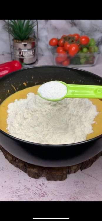 Step 1.1: Add flour and baking powder to the wet mixture and gently fold in