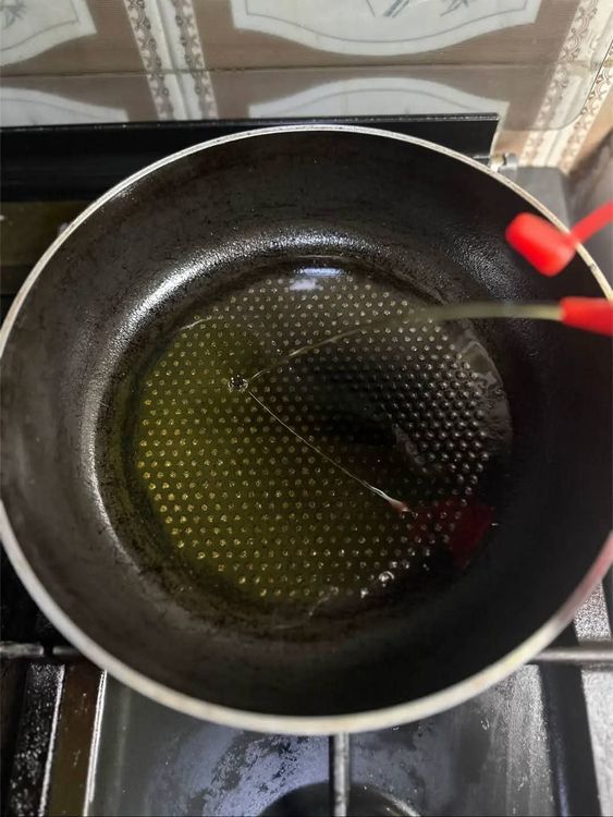 Step 1.4: Add oil to a pan and stir fry sliced onions for a few seconds