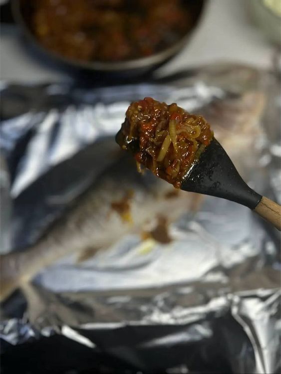 Step 2.2: Place the fish on foil and rub the prepared sauce all over the fish using a spoon or brush