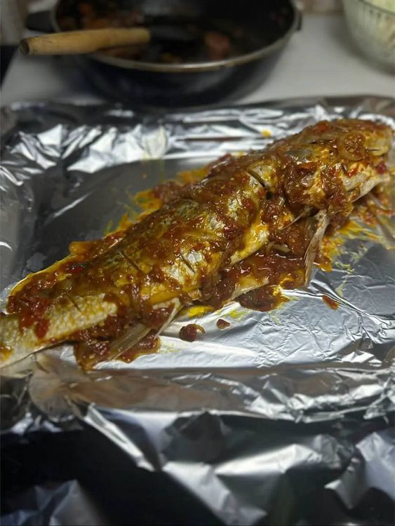 Step 2.1: Place the fish on foil and rub the prepared sauce all over the fish using a spoon or brush