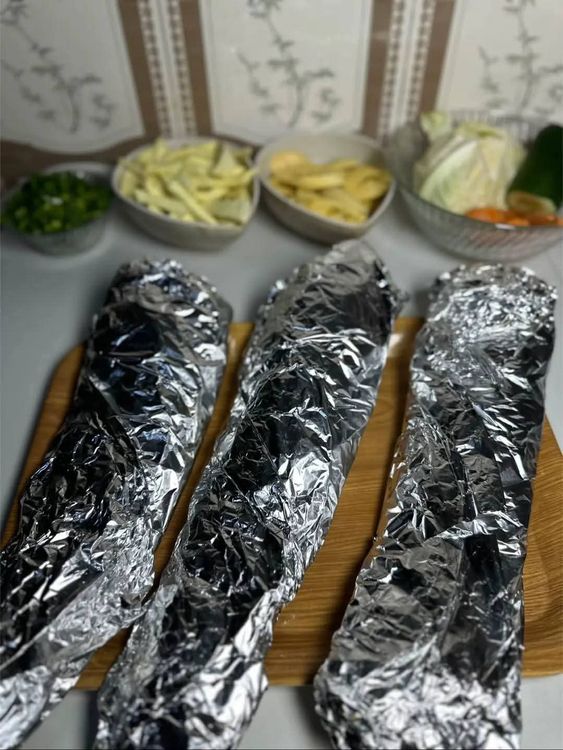 Step 2.1: Wrap the fish in foil and grill, flipping each side consistently until the fish softens and is ready