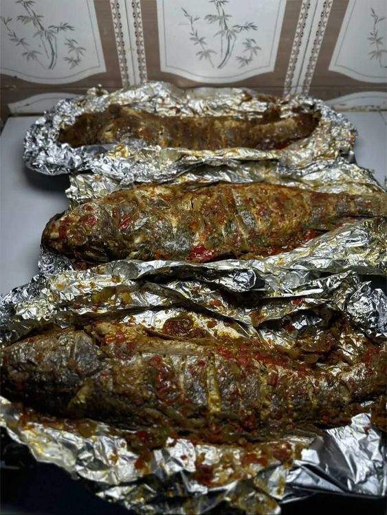 Step 2.2: Wrap the fish in foil and grill, flipping each side consistently until the fish softens and is ready