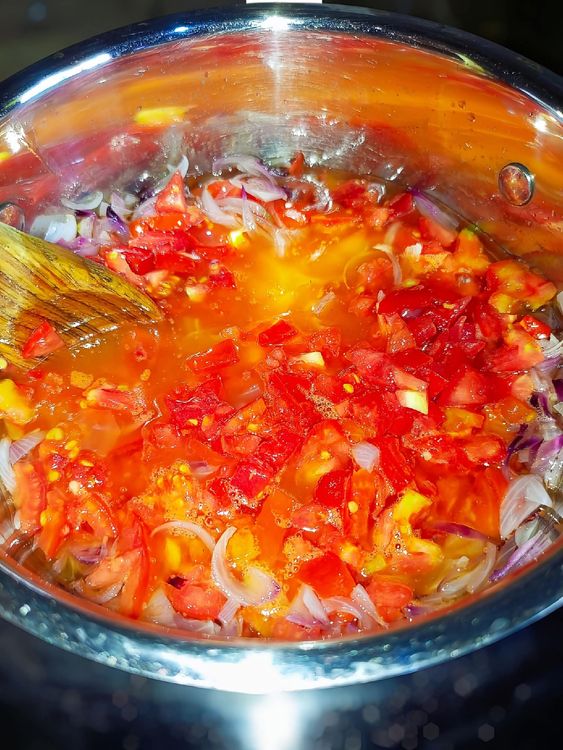 Step 1.1: Heat vegetable oil in a pot and stir-fry the sliced onions for 1 minute