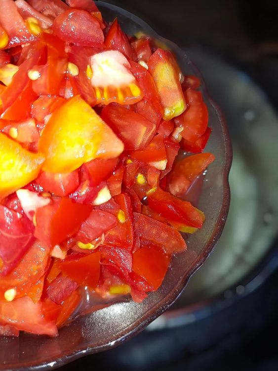 Step 1.2: Add the sliced fresh tomatoes and stir-fry for a few minutes