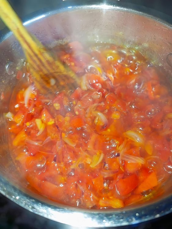 Step 1.4: Add the chopped fresh peppers, dry pepper, salt, and seasoning cubes