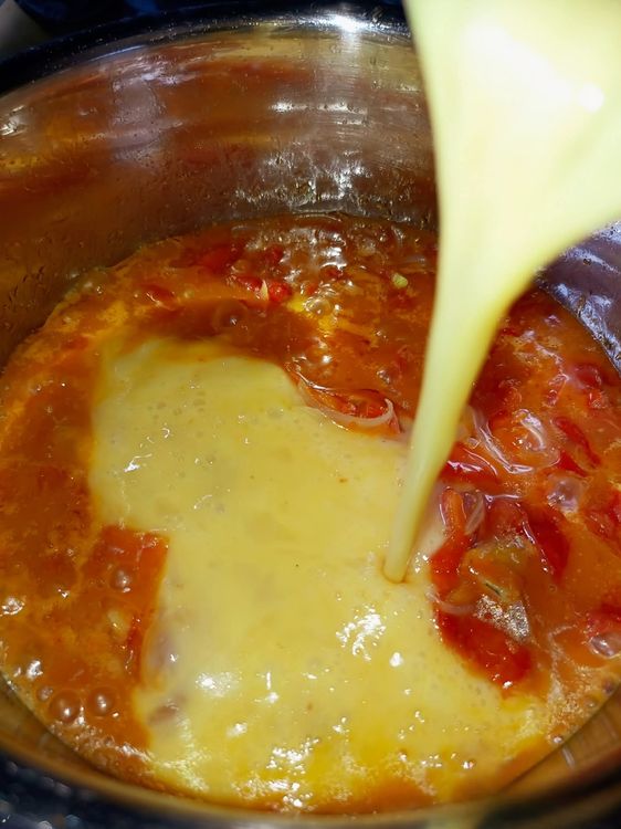 Step 1.2: Whisk the eggs and pour them evenly across the pot, ensuring they spread out