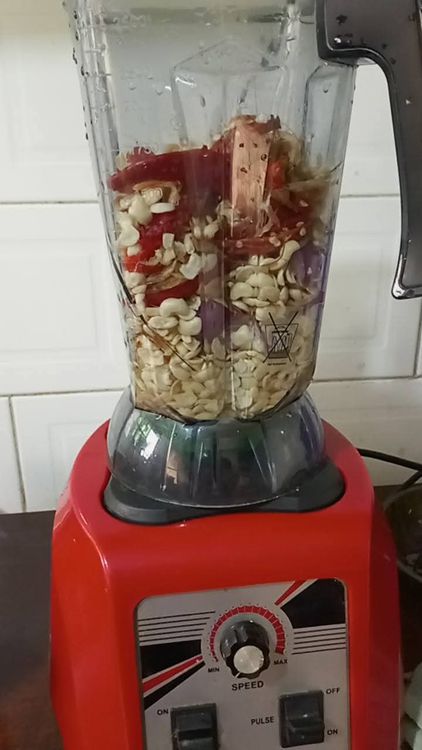 Step 2.4: Add the cleaned beans, onions, crayfish, red pepper, and shombo pepper to a blender