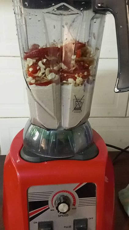 Step 2.1: Add the cleaned beans, onions, crayfish, red pepper, and shombo pepper to a blender