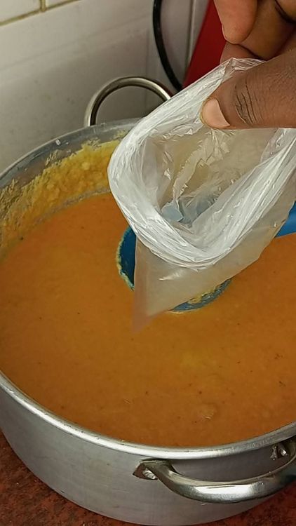 Step 3.3: Scoop 1 cup of the Moi Moi mixture into transparent nylon, Moi Moi leaves, foil paper, or aluminum foil plates
