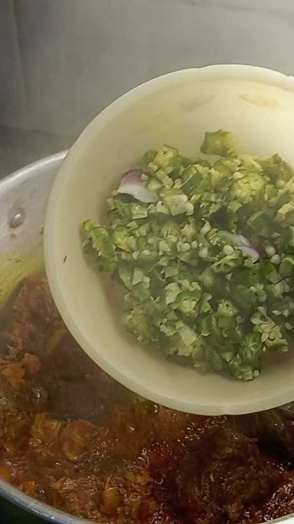 Step 1.2: After 2 minutes, open the pot and pour in a quarter portion of your chopped okra and half of the medium-sized chopped onion