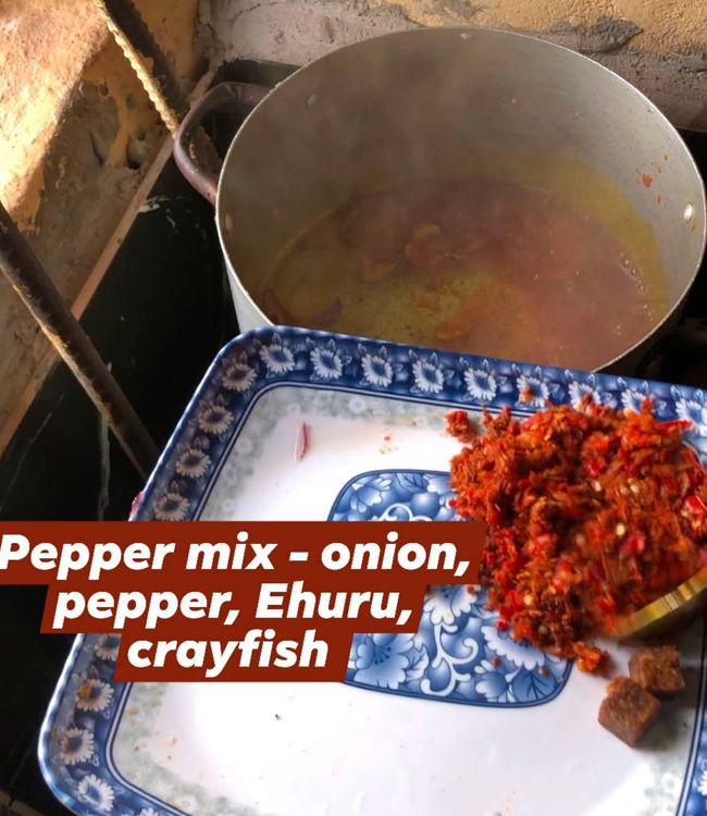 Step 2.2: Add chopped onions,stir fry for 1 minute,add ehuru powder (optional), coarsely ground fresh peppers, onions and crayfish