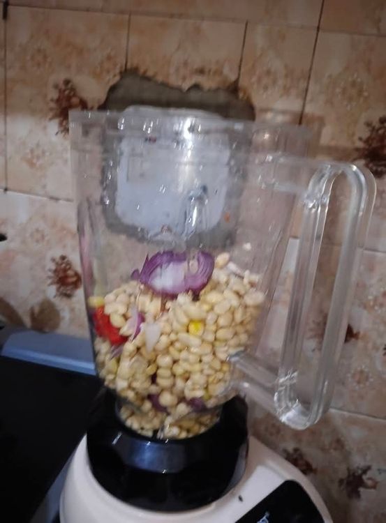 Step 2.2: Add the beans, onions, and peppers to a blender with 1 cup of water and grind until very smooth