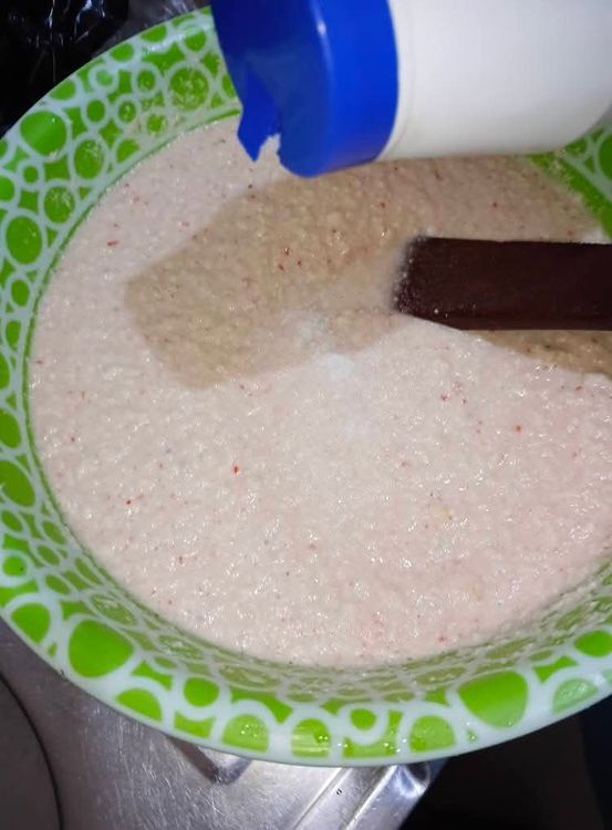 Step 2.2: Add half a teaspoon of salt, a seasoning cube (optional), and the egg