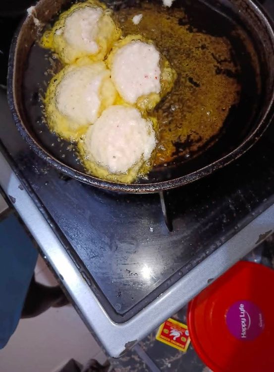 Step 3.1: Scoop the mixture with a deep spoon and gently drop it into the hot oil