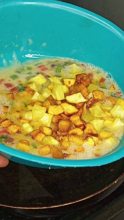 Step 2.2: Add the fried plantains and sweet potatoes to the egg mixture and stir gently