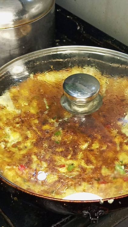 Step 2.1: Flip the omelette to cook on the other side