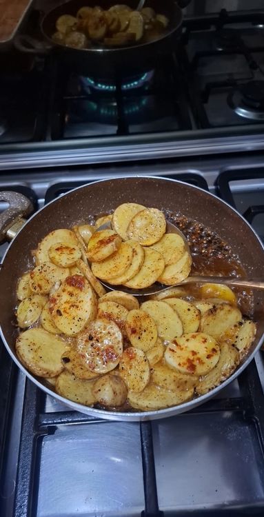 Step 1.2: Heat oil in a pan and fry the potato slices until both sides are golden brown and crispy