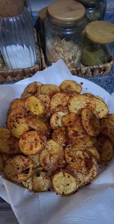 Step 1.1: Heat oil in a pan and fry the potato slices until both sides are golden brown and crispy