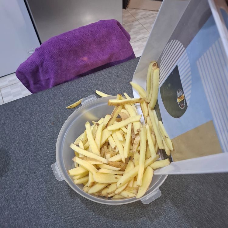 Step 1.3: Place the sliced potatoes into a bowl, wash them properly, and drain the water