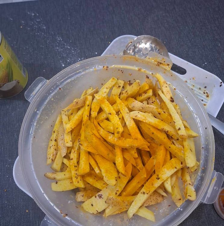 Step 1.1: Sprinkle Himalayan salt, dry crushed red pepper, ground turmeric, and corn flour over the potatoes