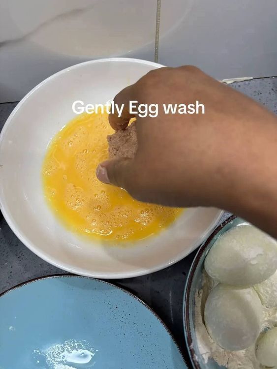 Step 3.3: Gently egg wash the bun, then coat it with bread crumbs