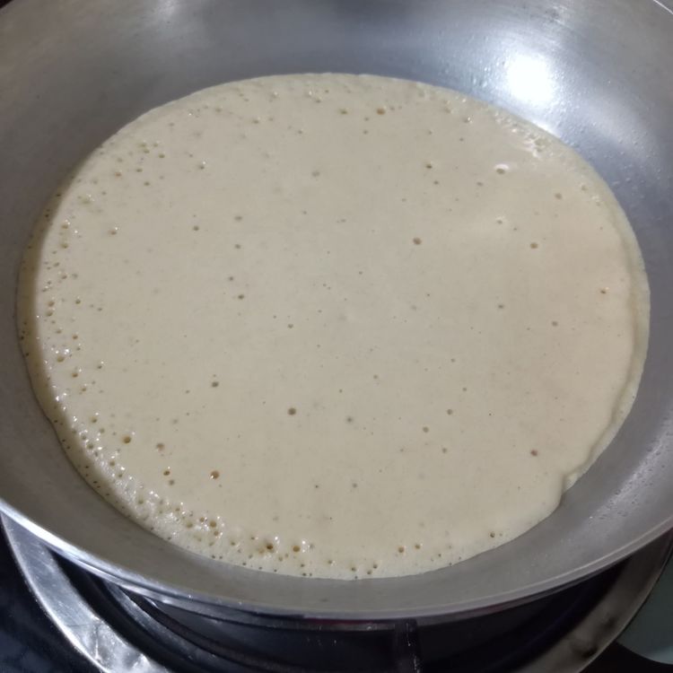 Step 1.1: Pour the batter onto the pan and let it spread