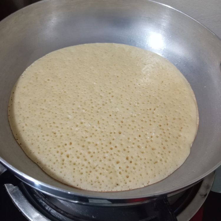 Step 1.1: Cook on low heat until holes form on the surface of the pancake