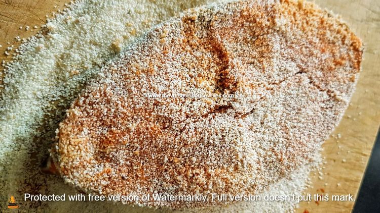 Step 1.1: Roll the marinated fish in rice flour or semolina