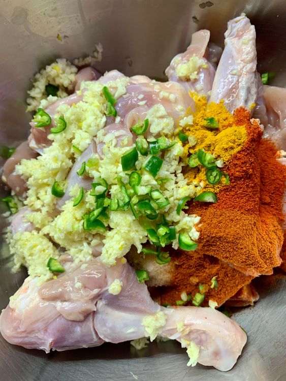 Step 1.1: Marinate chicken with minced garlic, salt, red chilli powder, kashmiri chilli powder, chopped green chilli, lemon or vinegar and turmeric