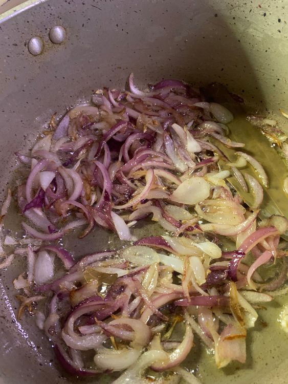 Step 3.1: Add the sliced onions and stir fry until golden