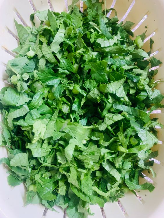 Step 1.1: Wash the chopped leaves and drain the water