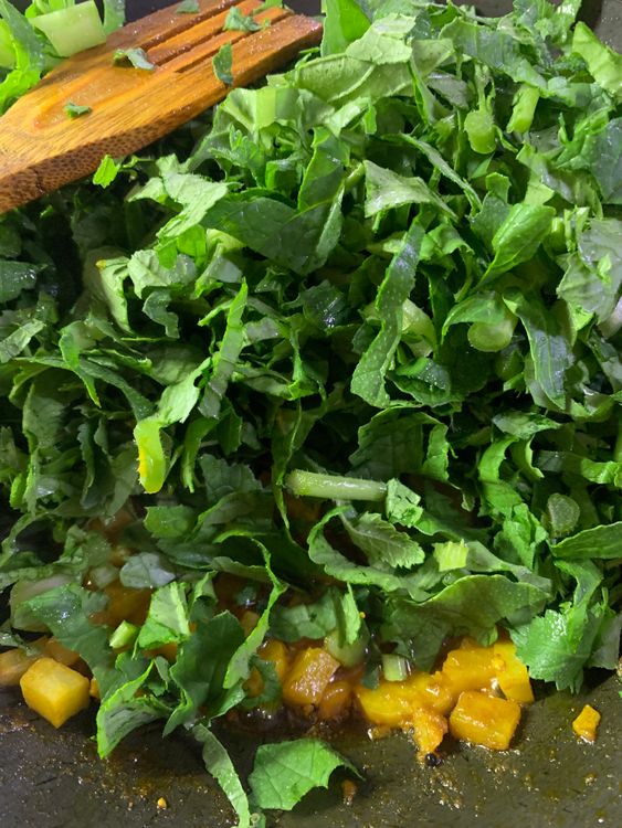 Step 1.1: Now add the chopped leaves to the cooked radish