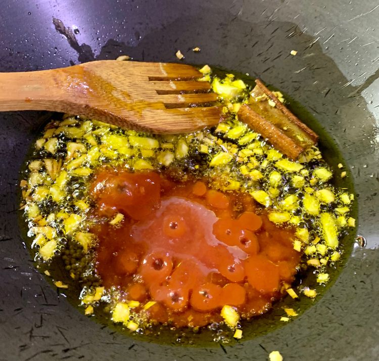 Step 1.1: Add the tomato puree and green chillies