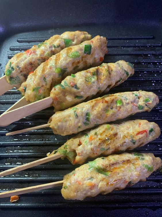 Step 1.2: Using a brush, apply a small amount of oil on the kebabs frequently to ensure that the chicken kebabs do not dry out