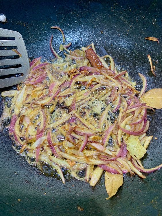 Step 3.1: Add sliced onions and fry until golden at the edges