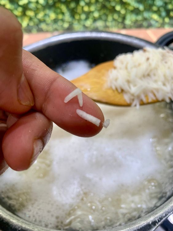 Step 1.1: Add soaked rice and cook until it’s 70–80% done (grains should still have a bite)