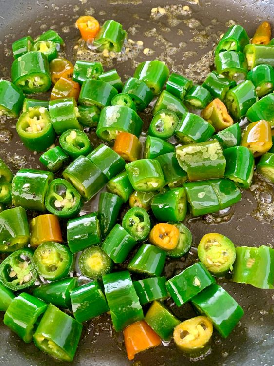 Step 1.1: Add the chopped green chillies to the pan