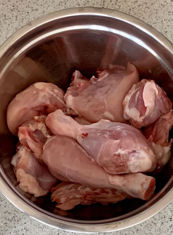 Step 2.1: Put the chicken pieces in a mixing bowl and add the ground mixture, curd, red chilli powder, salt, ginger and garlic