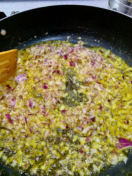 Step 2.1: In the same pan, add the chopped onions and the remaining 1 tsp salt