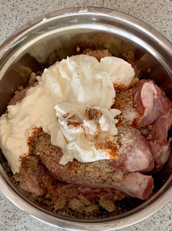 Step 2.3: Put the chicken pieces in a mixing bowl and add the ground mixture, curd, red chilli powder, salt, ginger and garlic