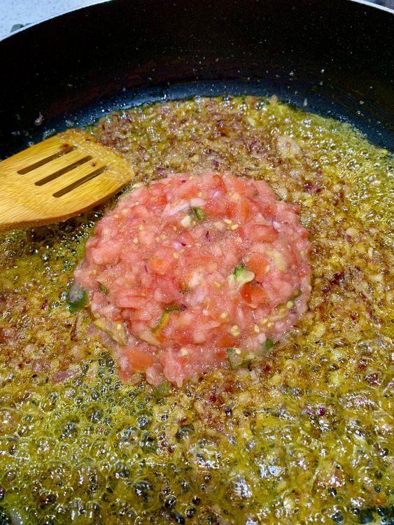 Step 2.1: Add ground tomatoes and green chillies