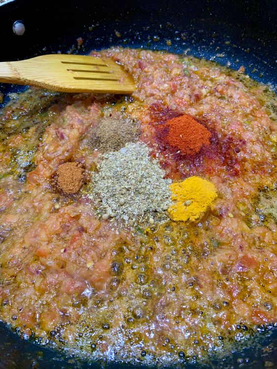 Step 2.1: Stir in degi chilli, turmeric, coriander powder, cumin powder, and garam masala