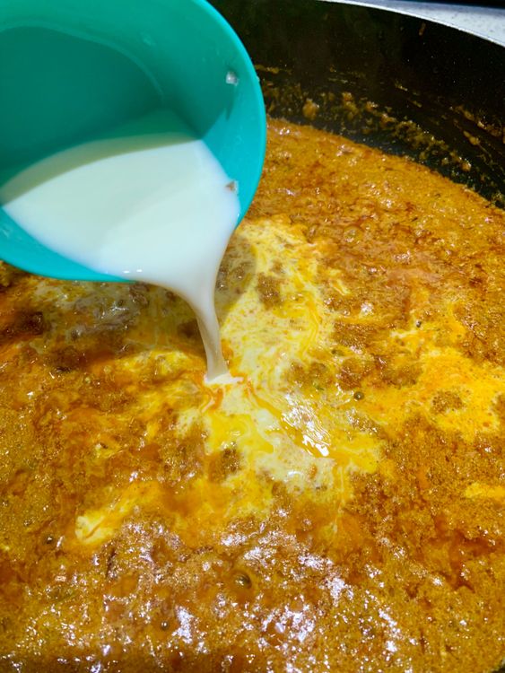 Step 3.1: Pour in the milk and add crushed kasuri methi