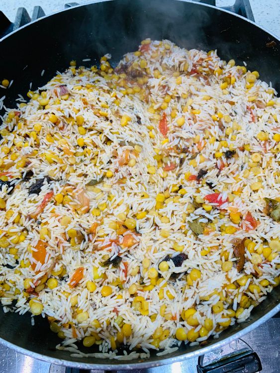 Step 4.2: Gently mix in the soaked rice, being careful not to break the grains