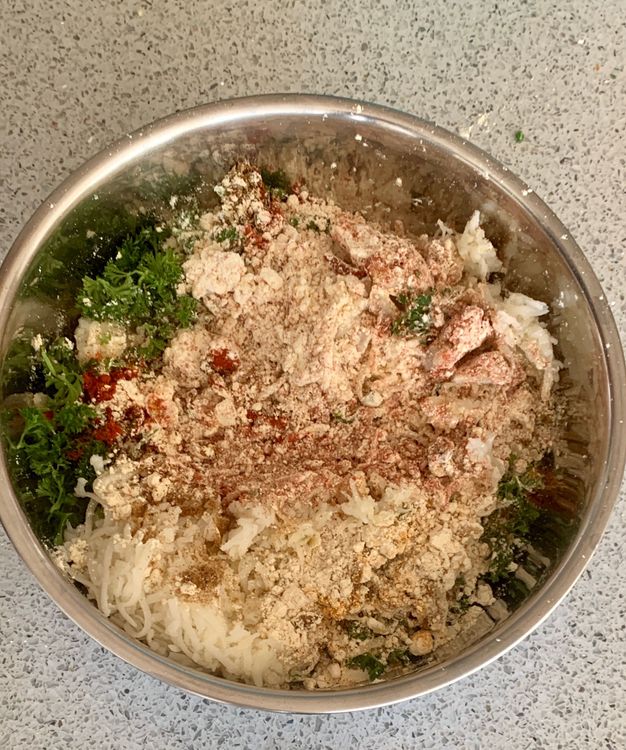 Step 1.1: In a mixing bowl, combine the boiled rice, boiled potato, green chillies, ginger, gram flour, red chilli powder, cumin powder, carom seeds, sesame seeds, turmeric, coriander powder, chat masala, salt and oil
